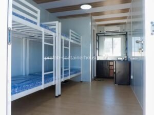 Interior of a flat pack house used for site accommodation, featuring durable bunk beds in a flat pack shipping container