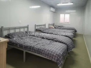 Three-bed bedroom interior within a flat pack home kit, ideal for flat pack housing projects and temporary worker stays