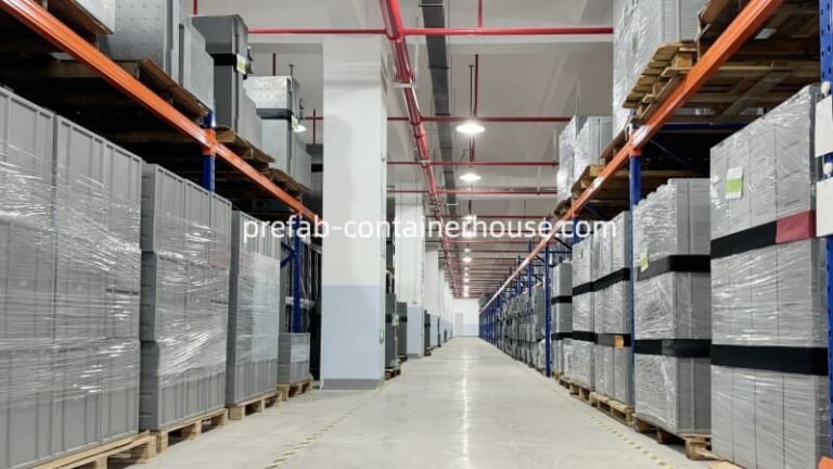 Warehouse storage for portable toilet components with gray panels and parts neatly stacked on industrial shelving.